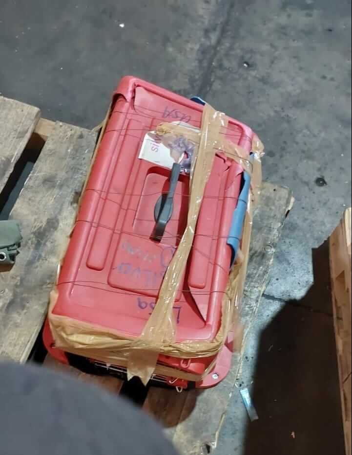 red crate covered in duct tape