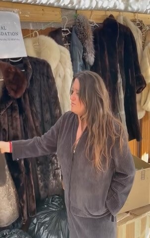 Ukrainian looking at fur coats PETA donated