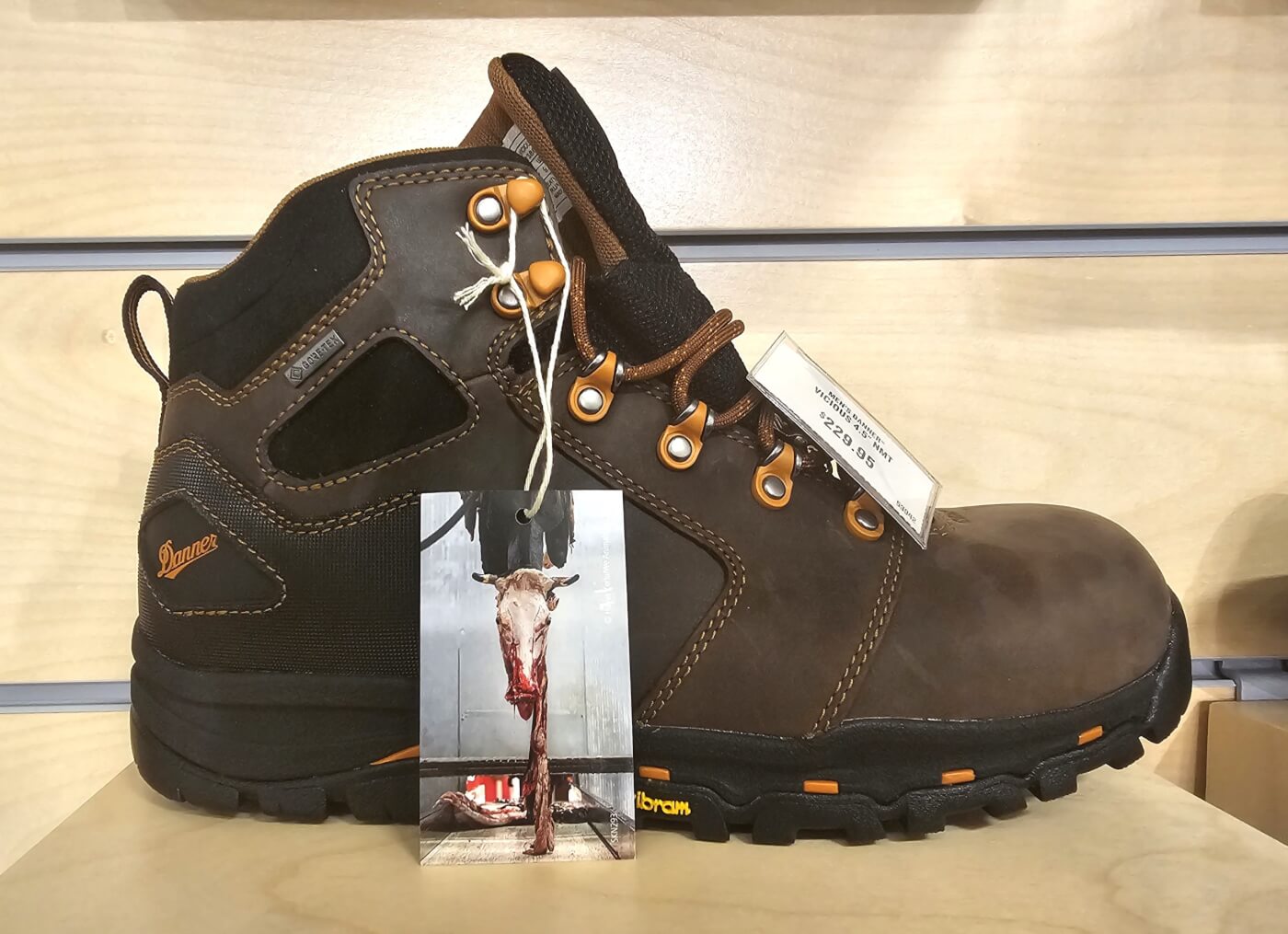 Photo of a leather shoe with a leather takes lives hangtag