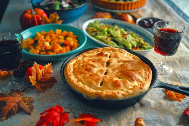 vegan thanksgiving food like squash, pie, and snap peas