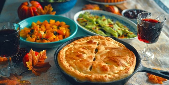 vegan thanksgiving food like squash, pie, and snap peas