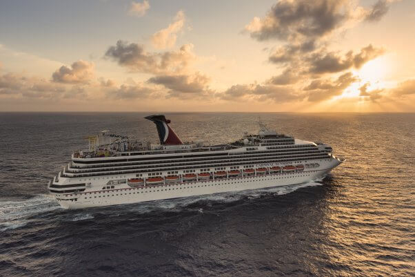 Carnival cruise ship "Sunshine" sailing towards a sunset