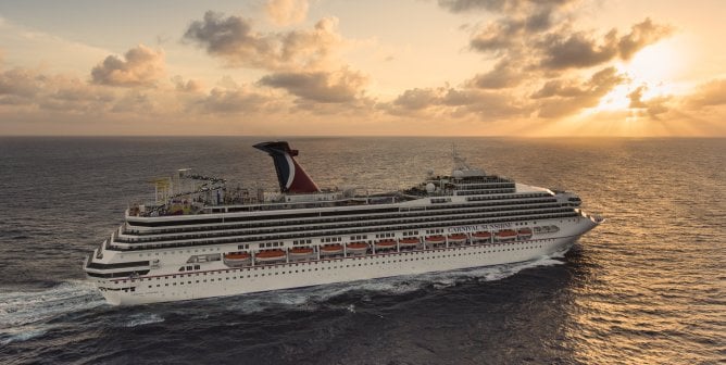 Carnival cruise ship "Sunshine" sailing towards a sunset