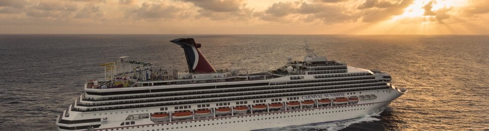 Carnival cruise ship "Sunshine" sailing towards a sunset