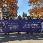 A group of demonstrators with a banner