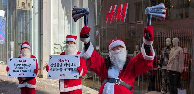 ‘Santas’ Hand Out ‘Axes’ Outside H&M to Protest Down Sales