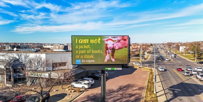 A digital billboard reads: "I am not a jacket, a pair of boots, or a steak."