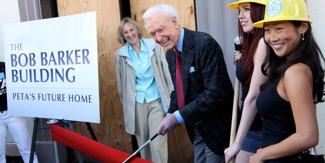 Bob Barker cutting a ribbon at the opening for the Bob Barker Building