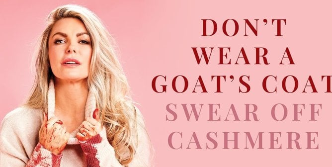 Crystal Hefner photographed against a pink background. She is wearing a white turtleneck splattered with blood and pulling down the neck. Text reads "Don't wear a goat's coat. Swear odd Cashmere"