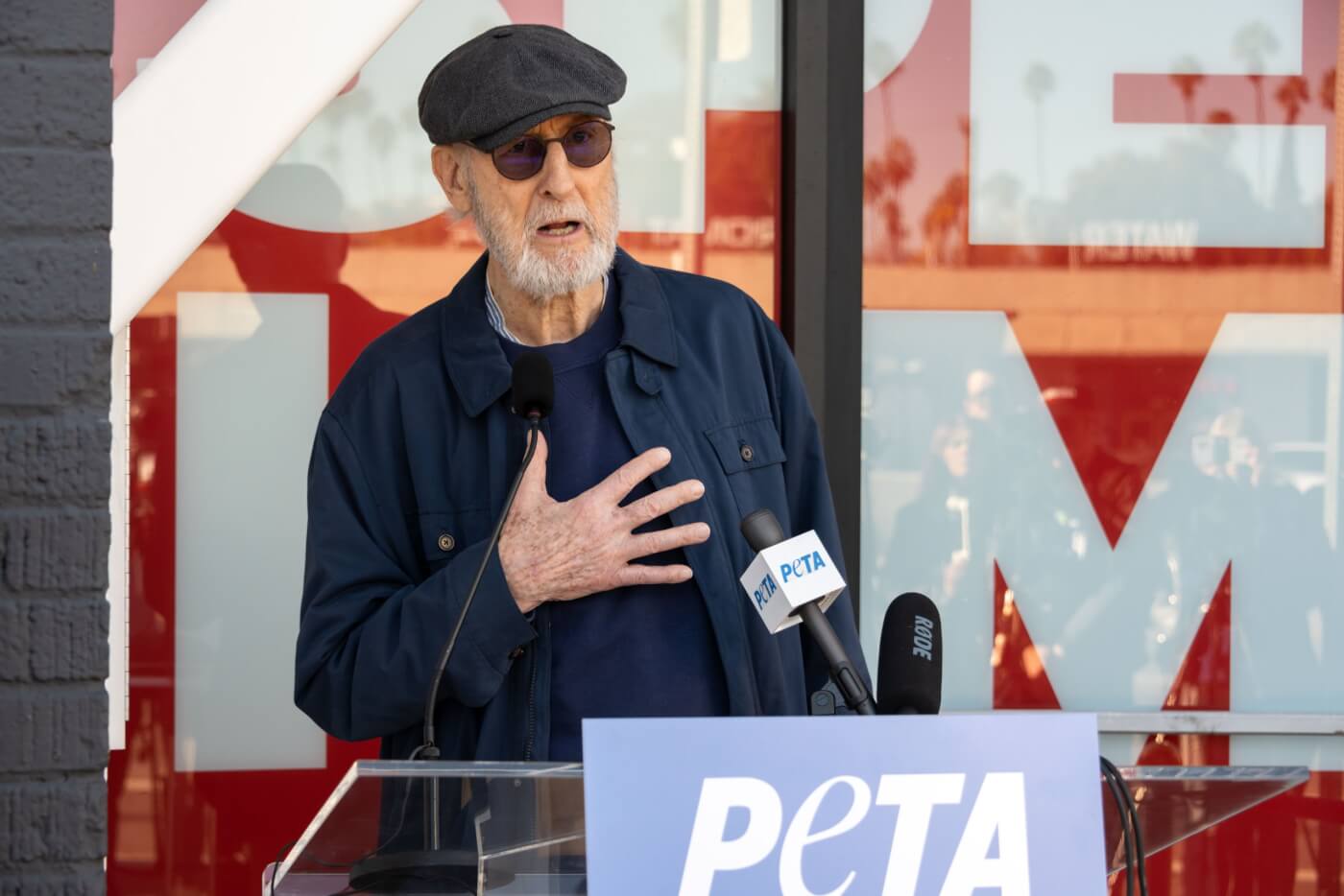 James Cromwell speaking at a PETA podium