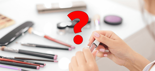 A red question mark over top of an image of makeup.