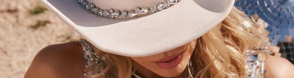 A woman wearing a white cowboy hat