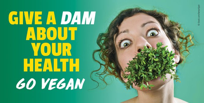 Person with greens coming out of their mouth next to text that says "Give a DAM about your health. Go Vegan"