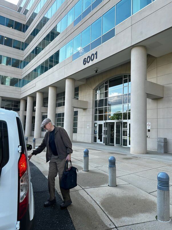 James Cromwell outside of a building