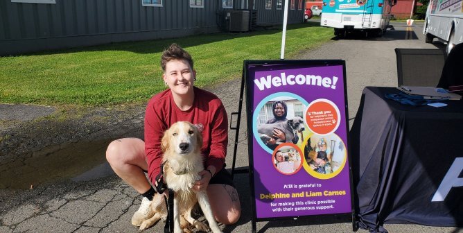 person and companion dog at spay/neuter clinic in galax, virginia