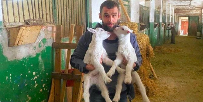 rescuer with two goats ukraine