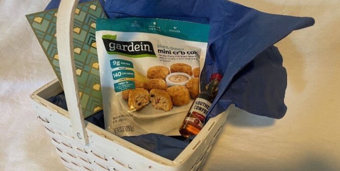 PETA basket with vegan crab cakes and a shot of whiskey, sent to CEO of bankrupt Red Lobster