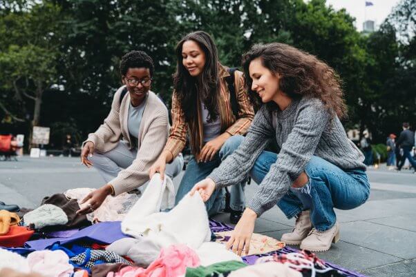 Three people shopping outside