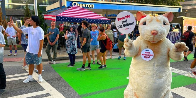 mouse protesting NIH at presidential debate