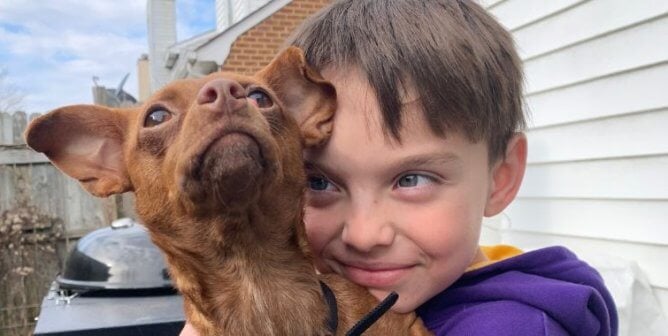 A child holding Billie