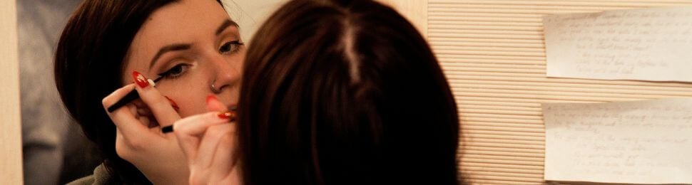 A person applying eyeliner