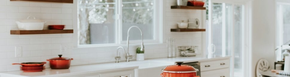 White kitchen with red accessories