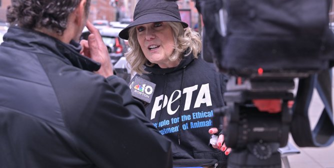 A PETA staff member being interviewed by a reporter