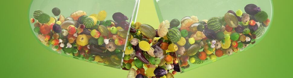 Clear capsule with fruits and veggies spilling out