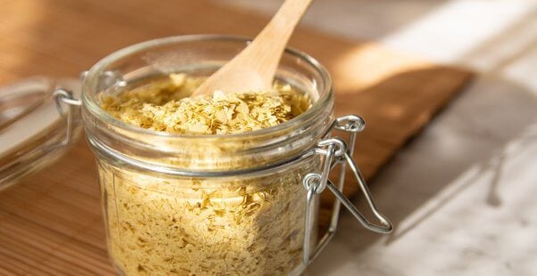 Nutritional yeast and wooden spoon