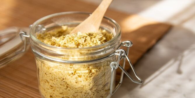 Nutritional yeast and wooden spoon