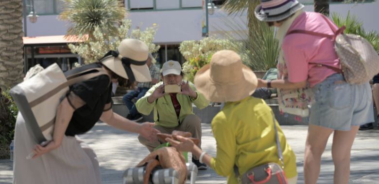 A group of people posing for a photo with Charli