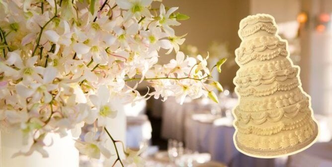 A weddinh cake next to flowers