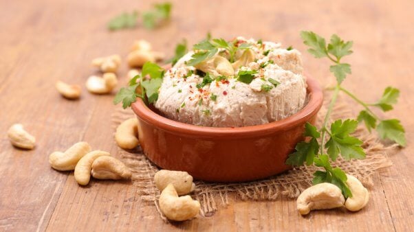 cashew cheese and loose cashews and herbs