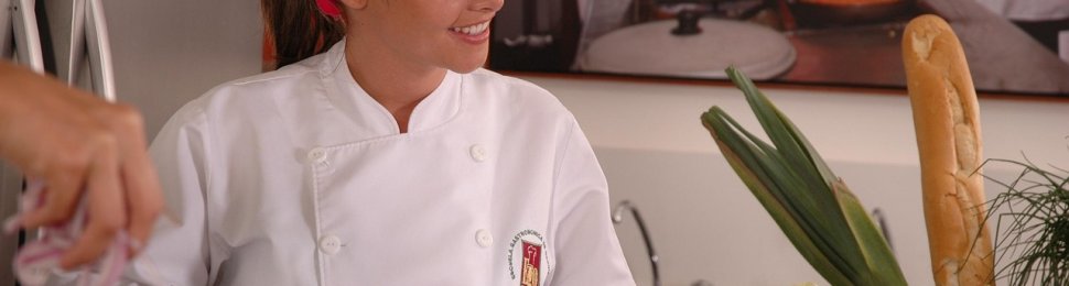 a chef chops peppers in the kitchen