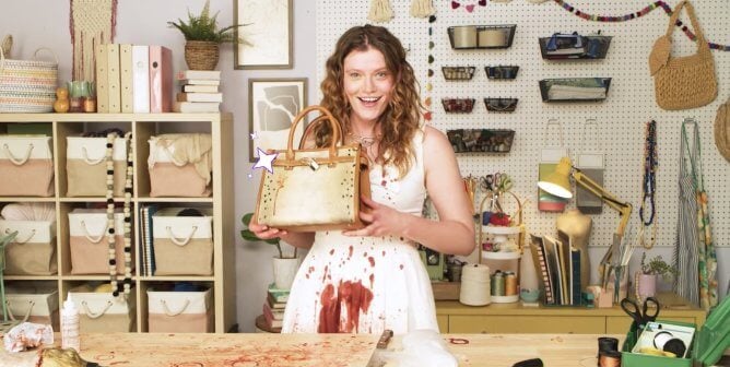 A woman holding a 'diy' birkin bag