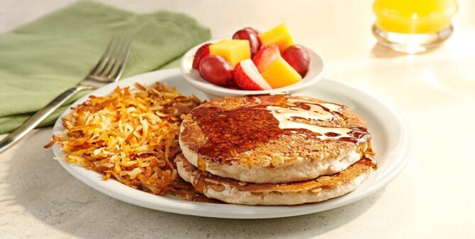 Vegan pancakes with hash browns and fruit