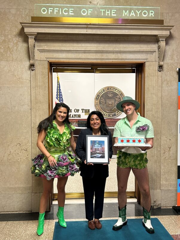 Lettuce lady, Mayor Office Rep, and Lettuce Lad pose in front of the Mayor's office