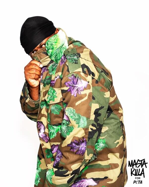Masta Killa posting in a camo lettuce jacket