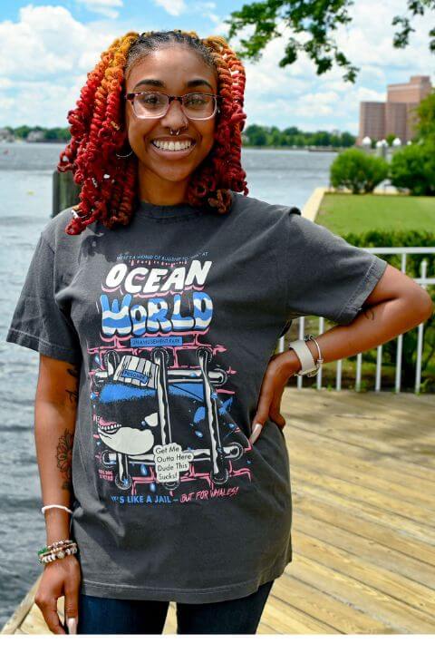 Model wearing a peta2 shirt available in the PETA Shop