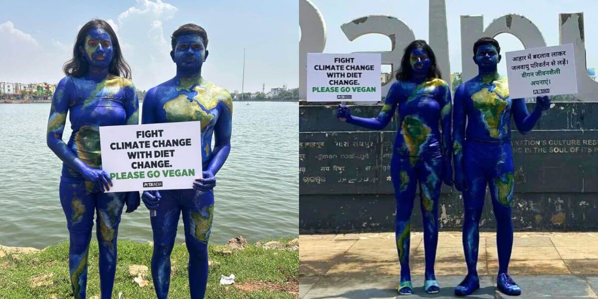 Two people in body paint holding up signs saying Fight Climate Change with Diet Change, Please Go Vegan