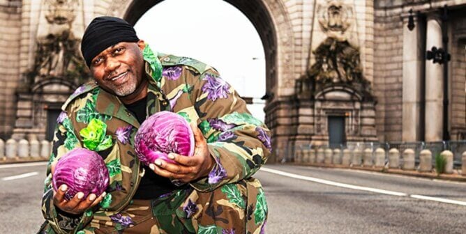 Masta Killa holding some purple cabbages