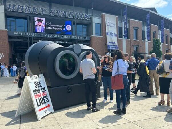 Demonstrators in front of PETA binoculars