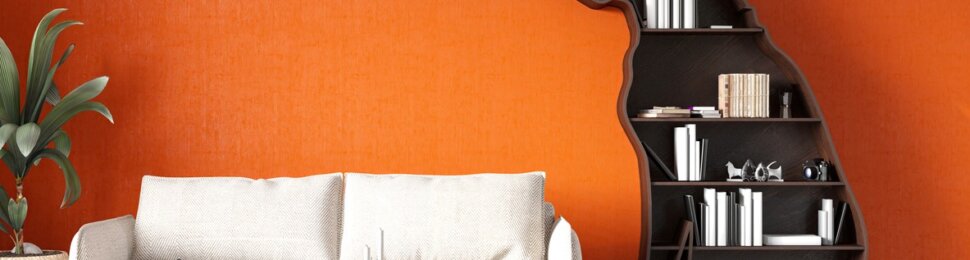 Dopamine decor - Room with orange walls, white couch, and dog-shaped bookshelves