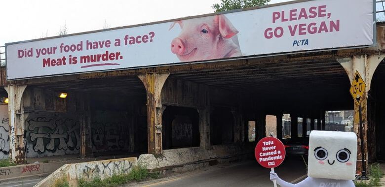 A billboard with text reading Did your food have a face? Meat is murder
