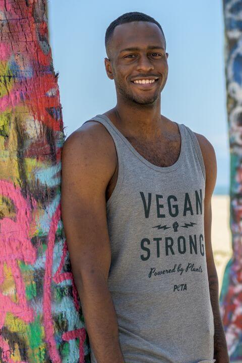 Mean wearing a Vegan Strong tank top