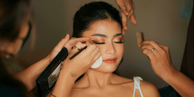 A woman having making applied