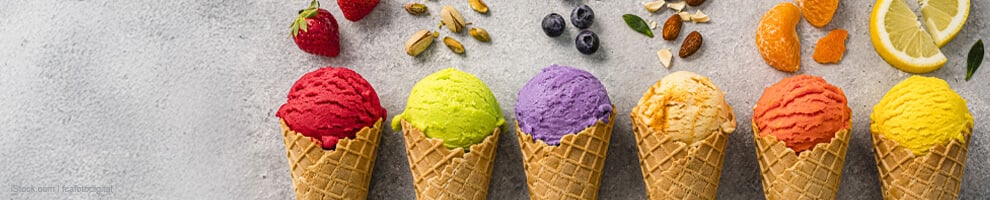 Colorful vegan fruit ice cream in waffle cones
