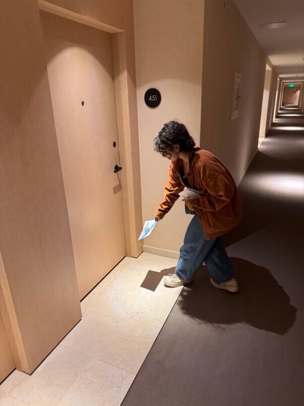 A person leafleting at a door