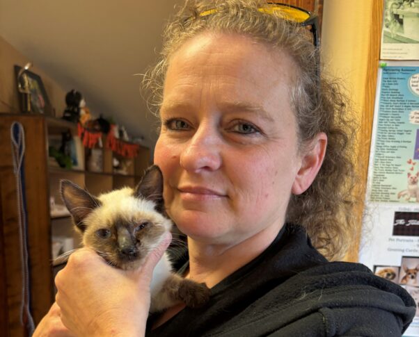 Yoda held by a fieldworker