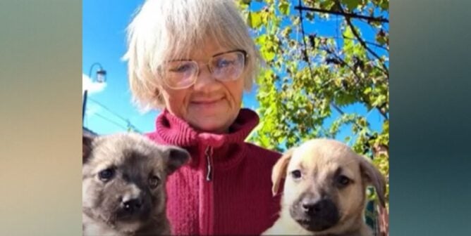 Tetiana with two puppies